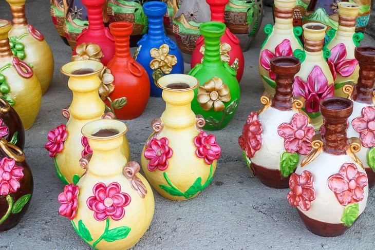 Display of colorful ceramic handicrafts for sale in San Juan de Oriente, a town of potters