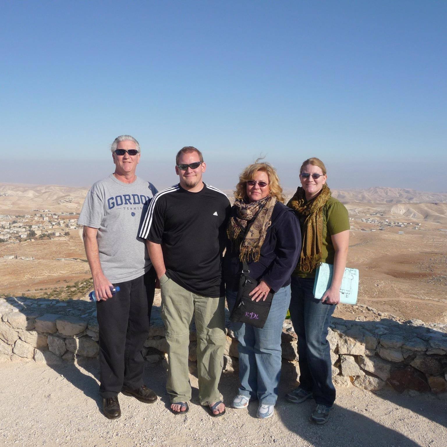 Nicole DePue with her family on top of the Herodium in Israel on Christmas Day in 2010, celebrating her graduation and shared moments in a significant historical location