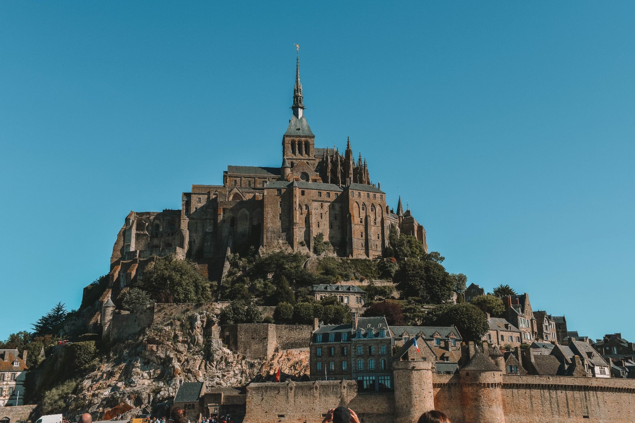 Mont Saint-Michel rising out of the sand, shining like a beacon into the sea