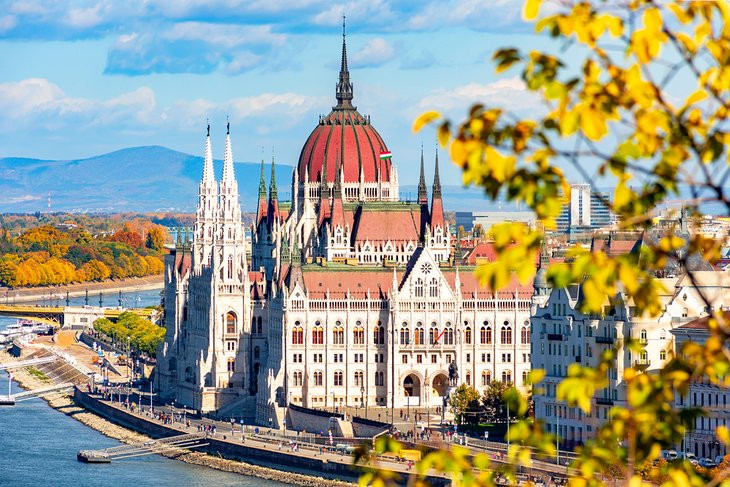 Hungarian parliament building in autumn, Budapest, Hungary, showcasing its architectural beauty and fall colors