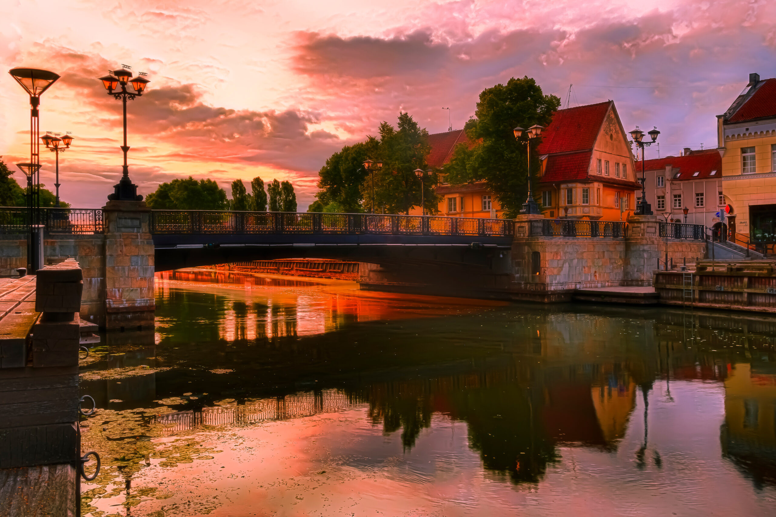 Old Town at sunrise in Klaipeda, Lithuania, a summer escape with its charming riverbanks and broad promenades.
