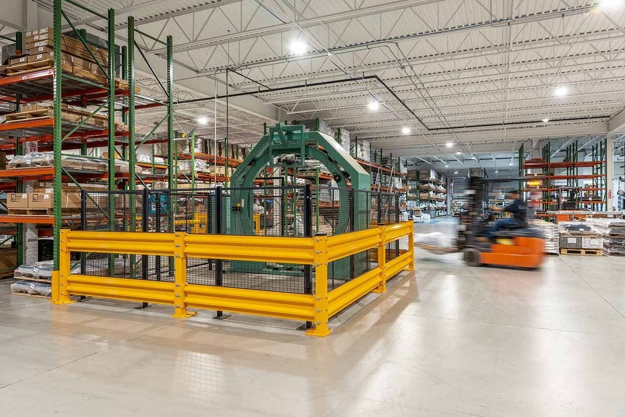 Warehouse guardrail separating pedestrian walkway from forklift traffic