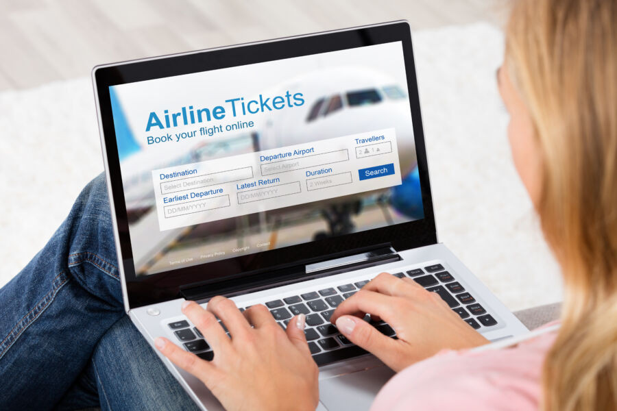 Online flight booking platform on a laptop