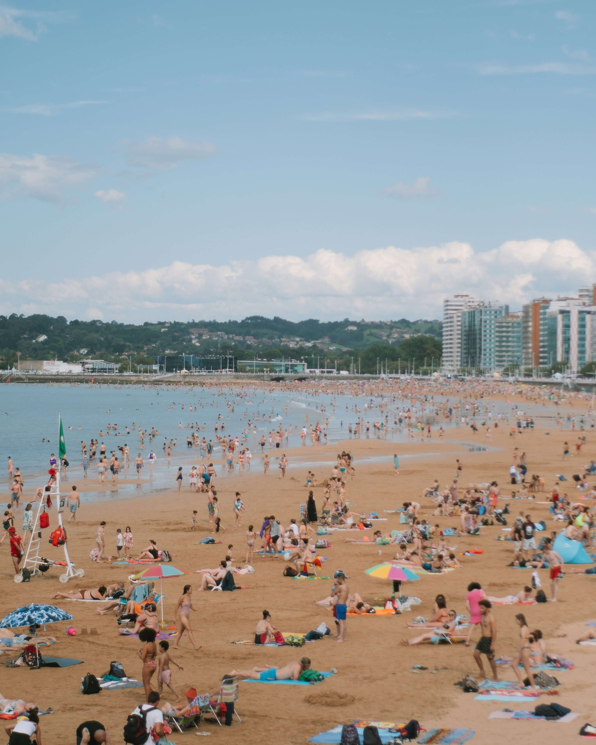 Overcrowded beaches in Spain, emphasizing the need for sustainable tourism practices
