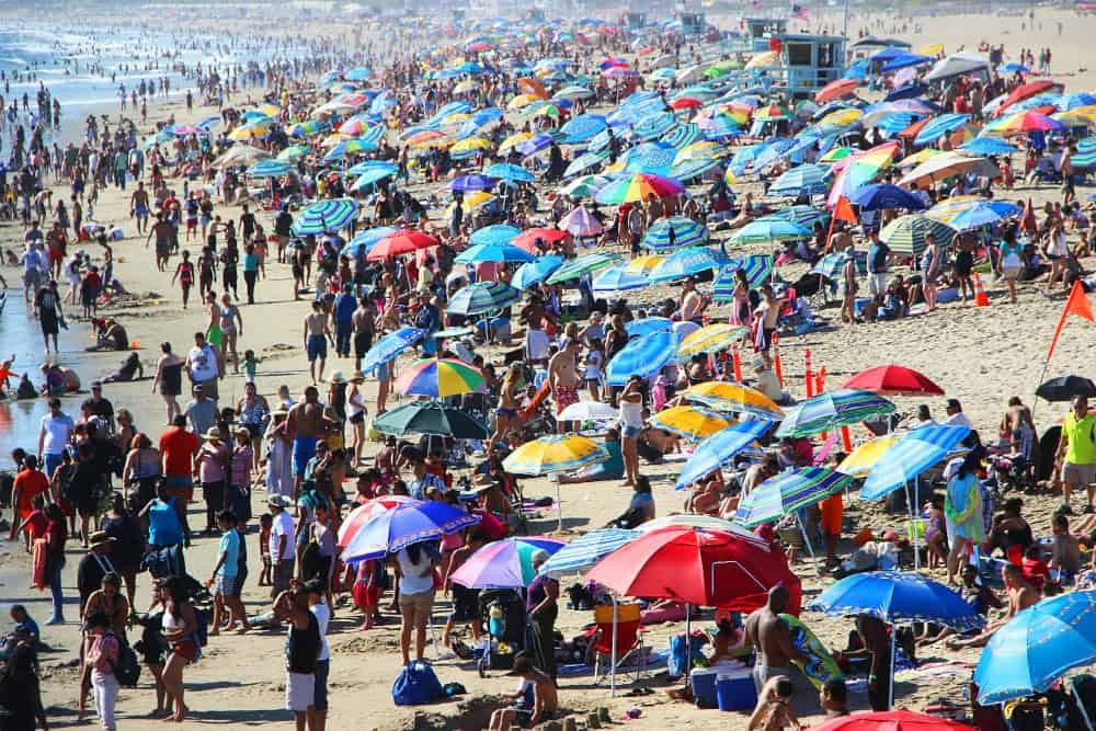 overtourism beach, aldric rivat pW2klXiCrFY unsplash 1000w