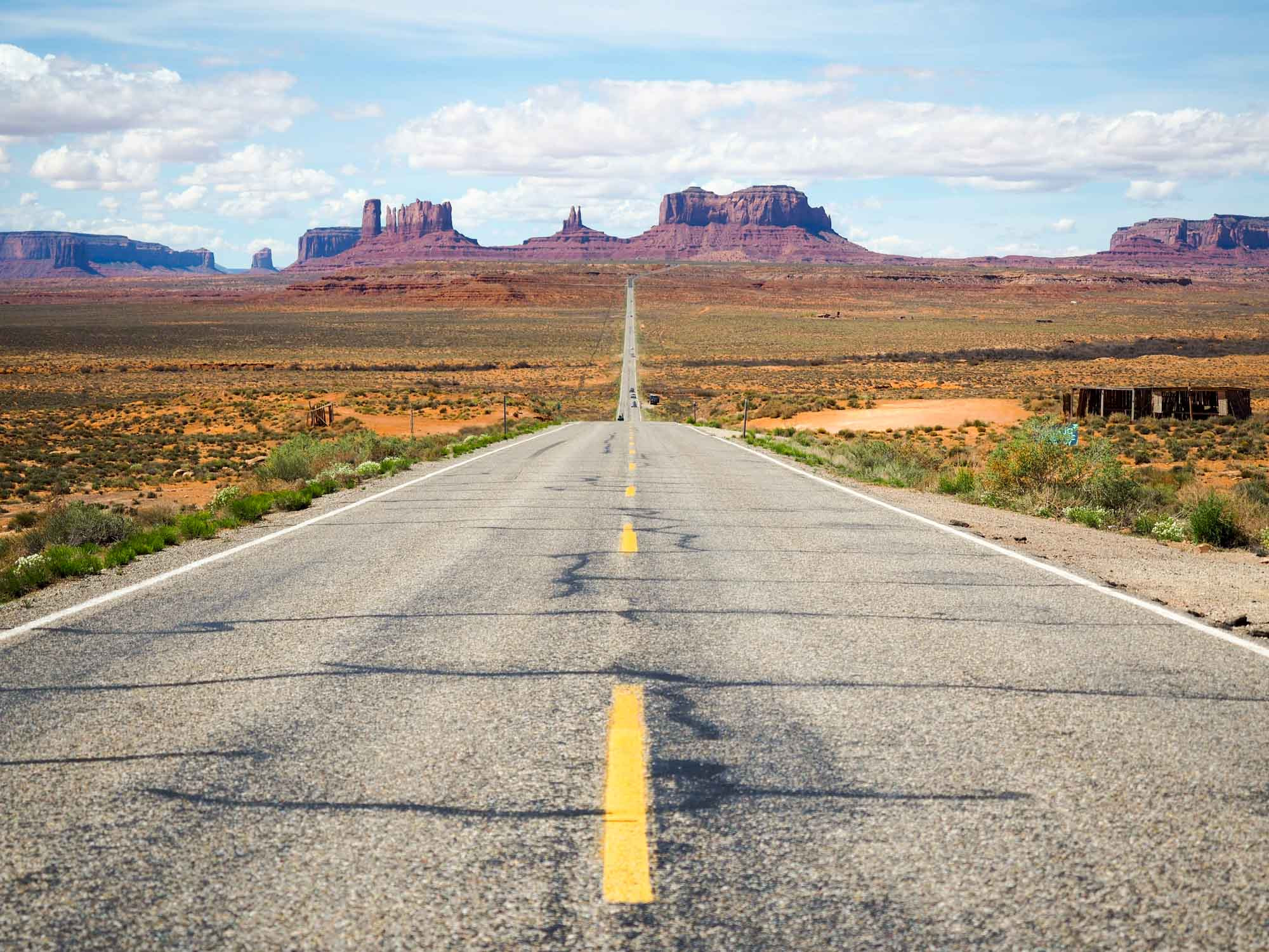Scenic overlook of the desert landscape in the Southwest, showcasing winding roads and towering rock formations