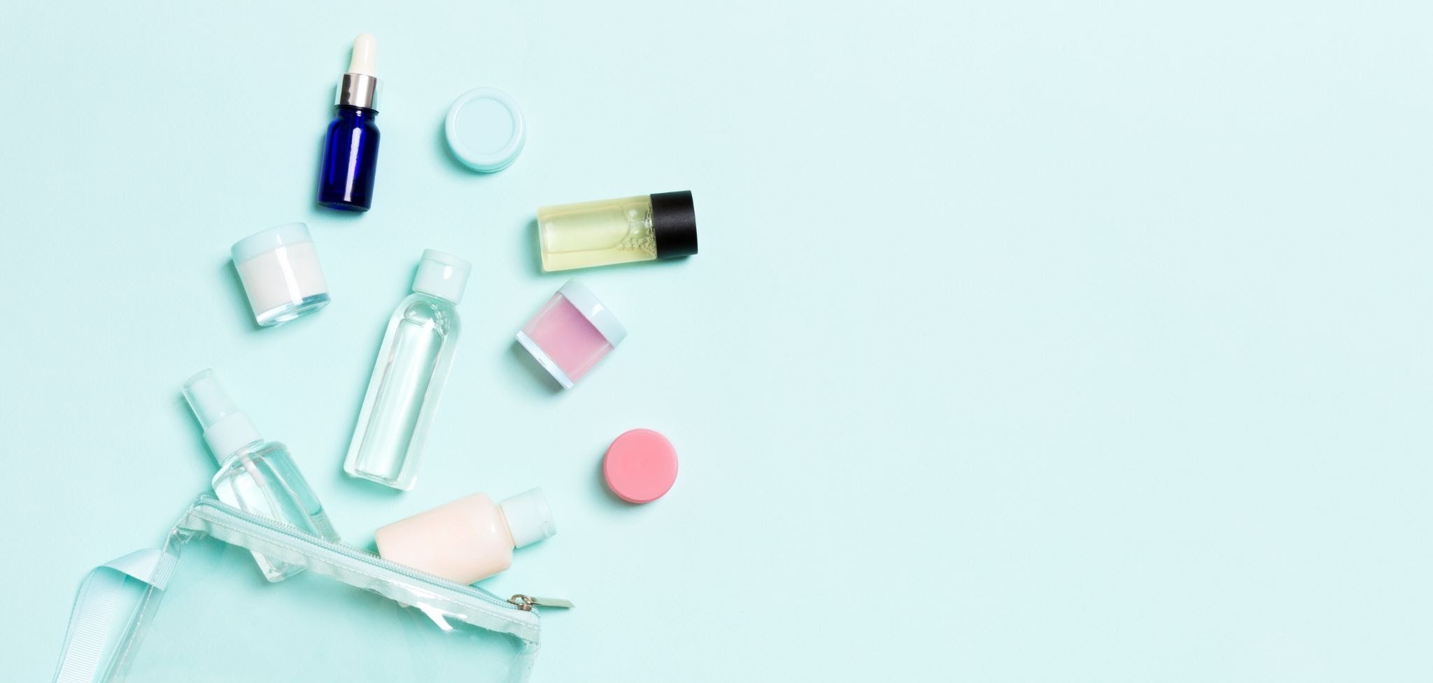 Gathering travel-sized toiletries including shampoo, conditioner, toothpaste, sunscreen, and lotion