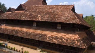 Padmanabhapuram Palace, showcasing the intricate wood carvings and traditional Kerala architecture