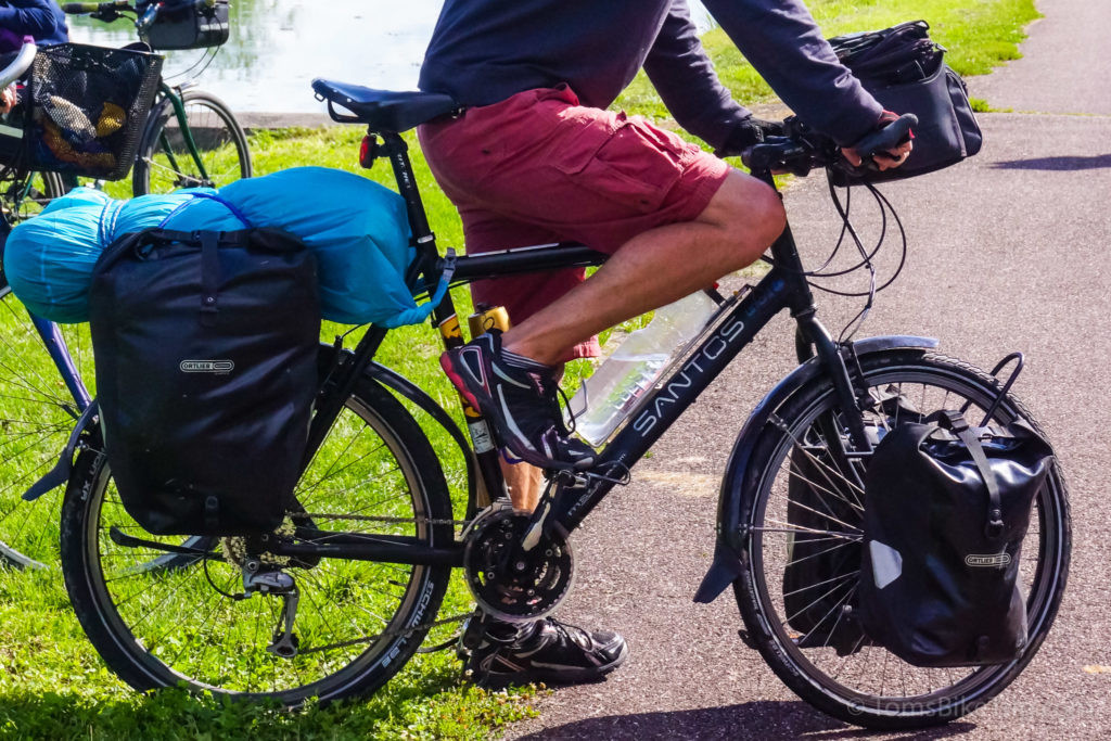 A fully-loaded Santos Travelmaster touring bike with its rider.