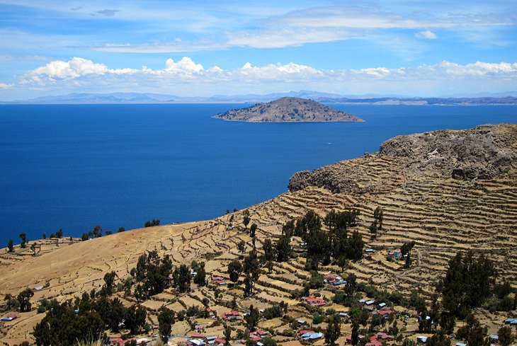 Lake Titicaca - Boat on the water with Isla Amantani in the background