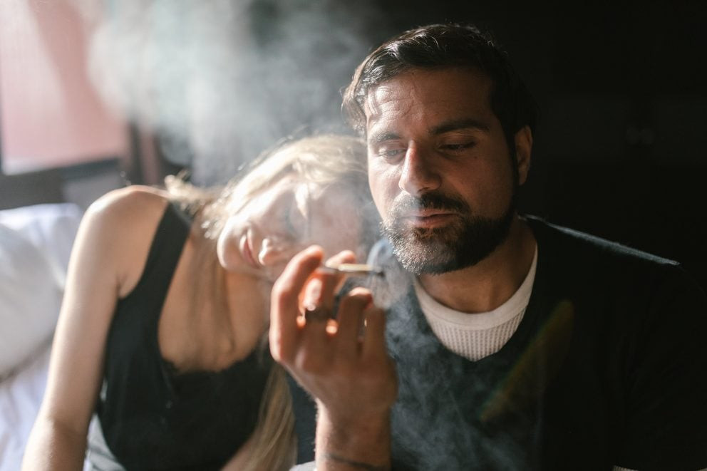 Woman and man smoking