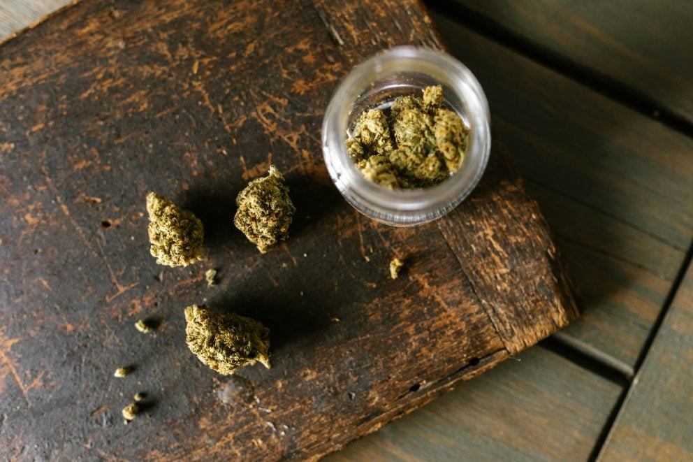 High angle shot of marijuana on wooden surface