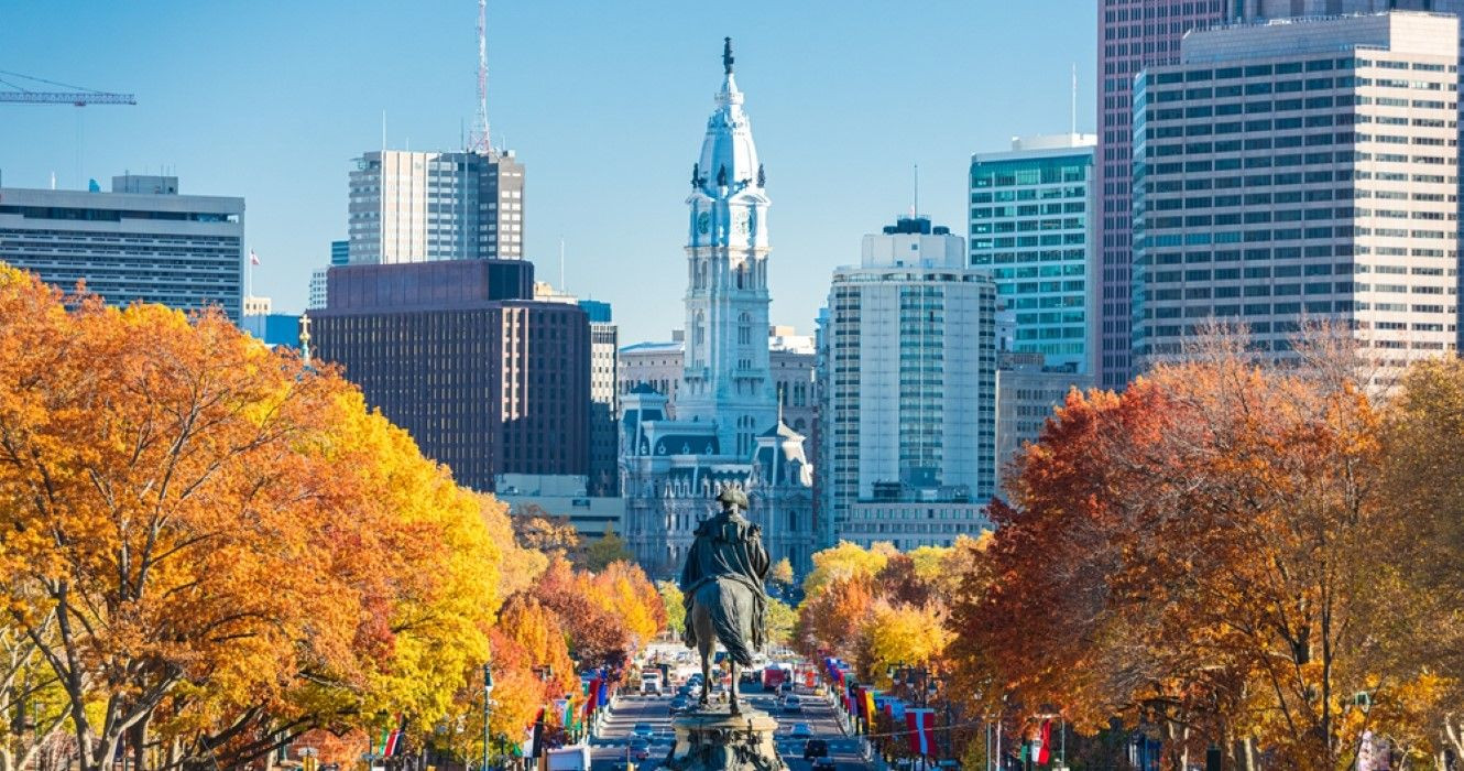 An autumnal view of Philadelphia, with the Benjamin Franklin Parkway in the foreground