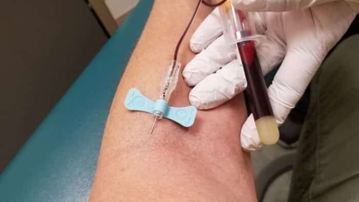 Traveling Phlebotomist Drawing Blood