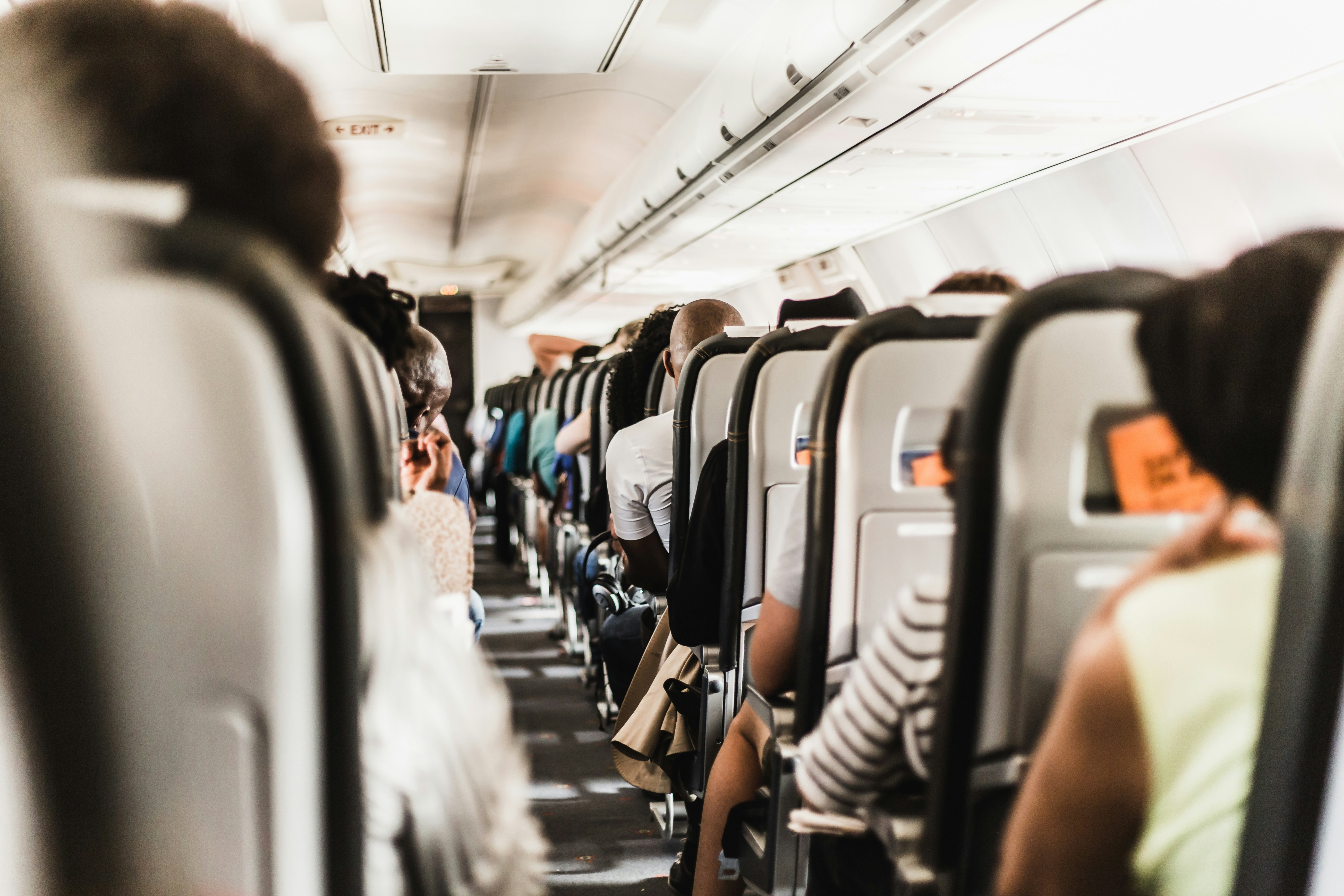 people seating in vehicle, A nice angle in the little comestic flight, narrow ilse made for some nice leading lines.