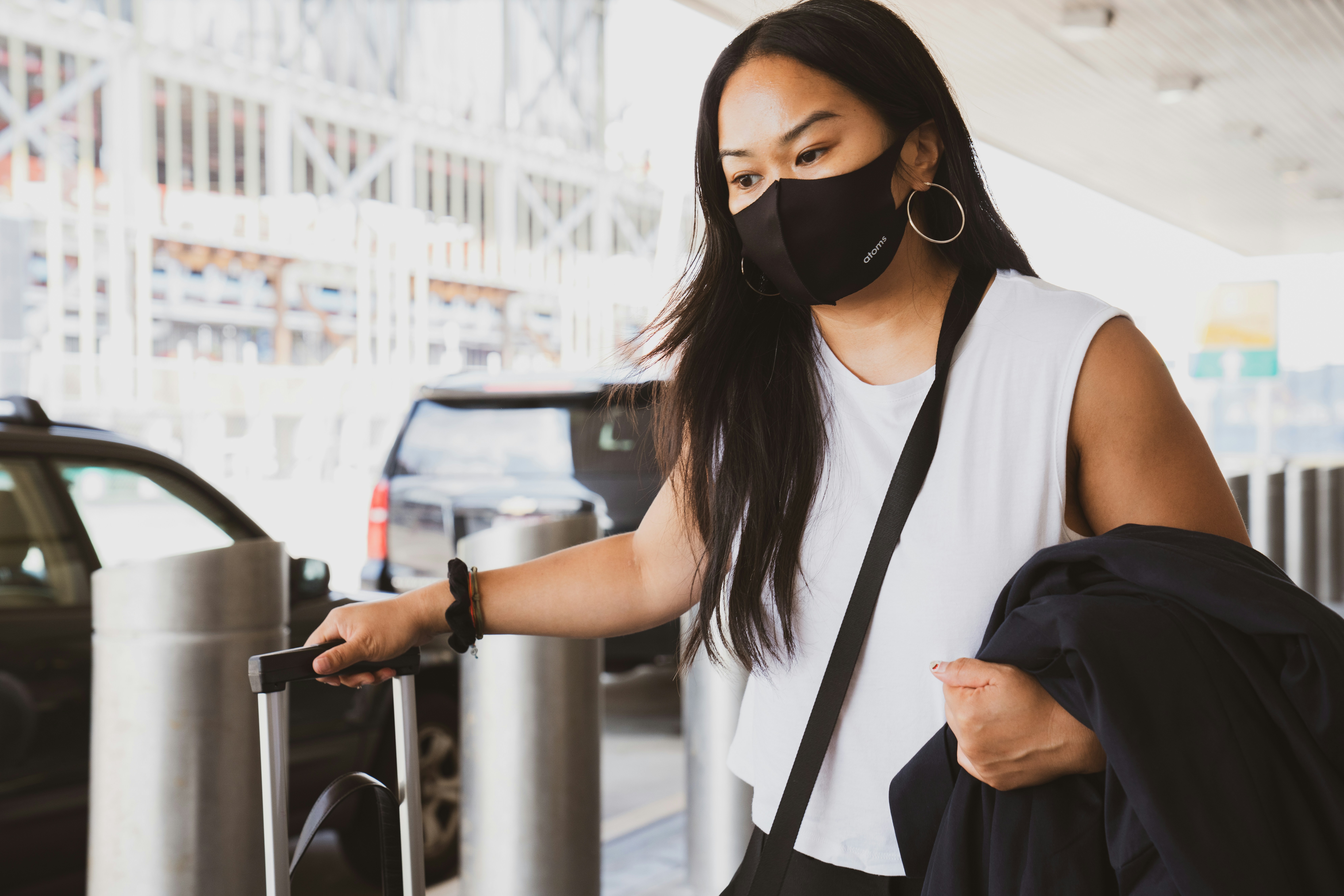 woman in black and white tank top wearing black sunglasses,