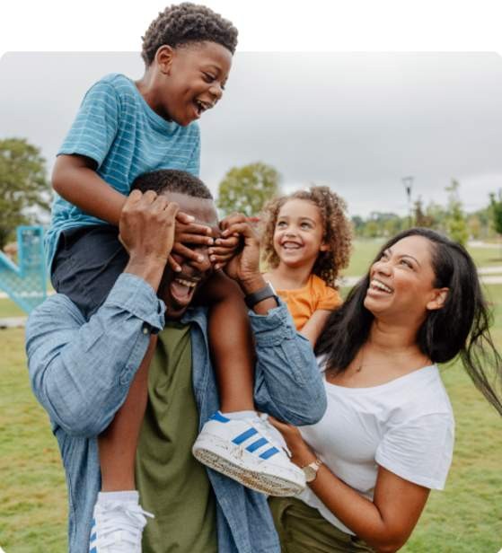 A happy family plays around at Unity Park in downtown Greenville, SC.
