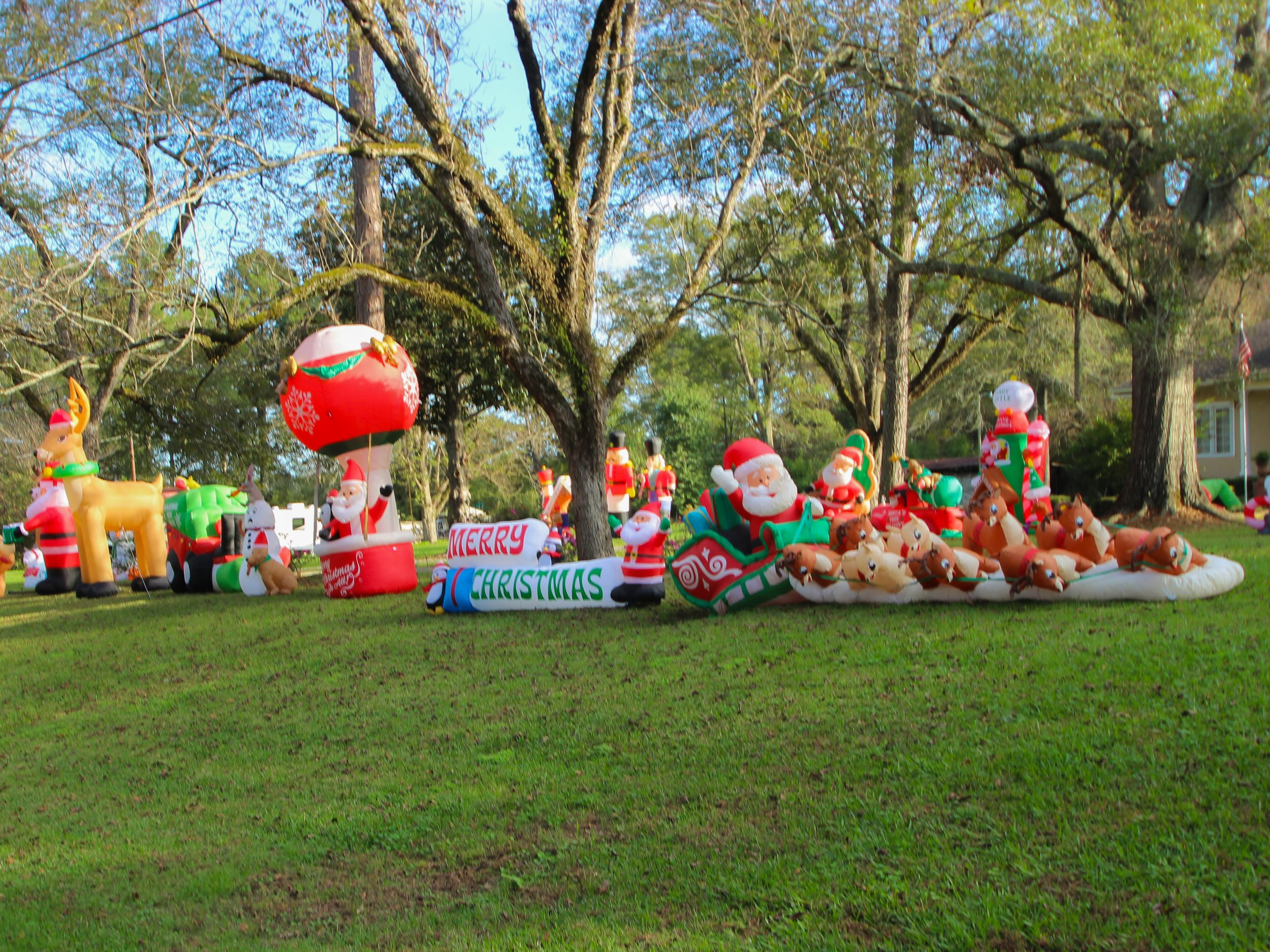 More Christmas inflatables in a yard