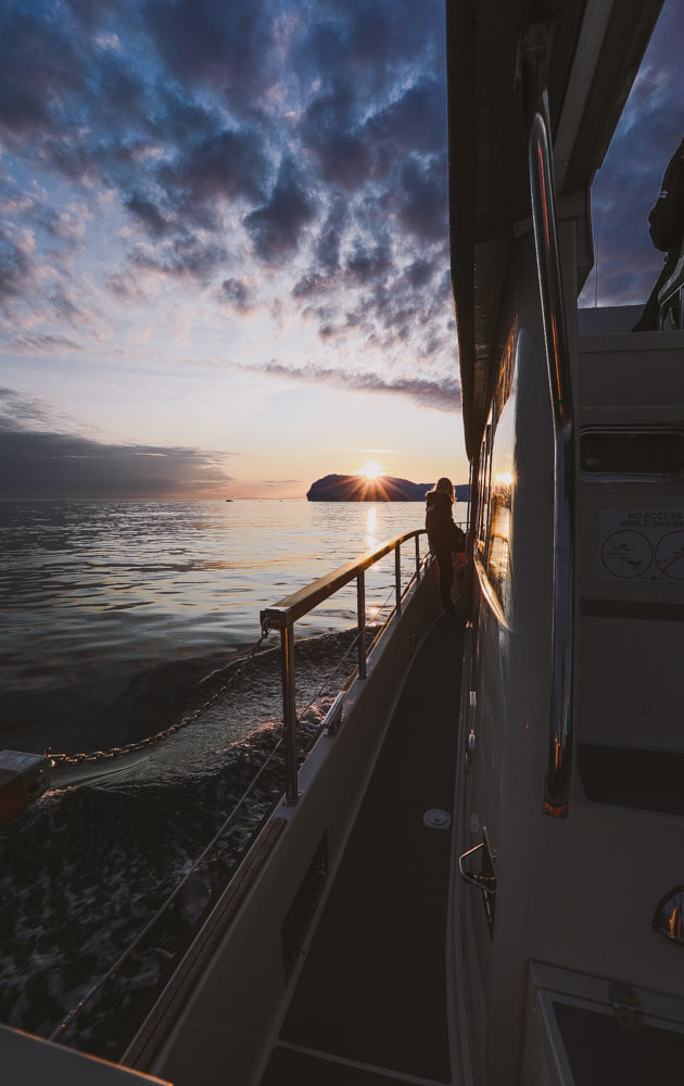 Sunset boat tour during Greenland travel