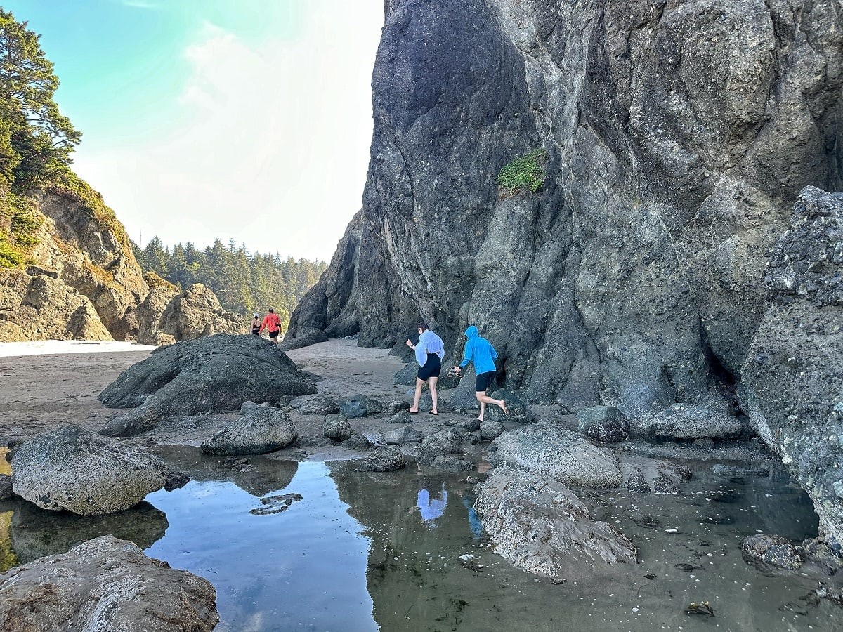 People walking around Point of Arches at Shi Shi Beach during low tide