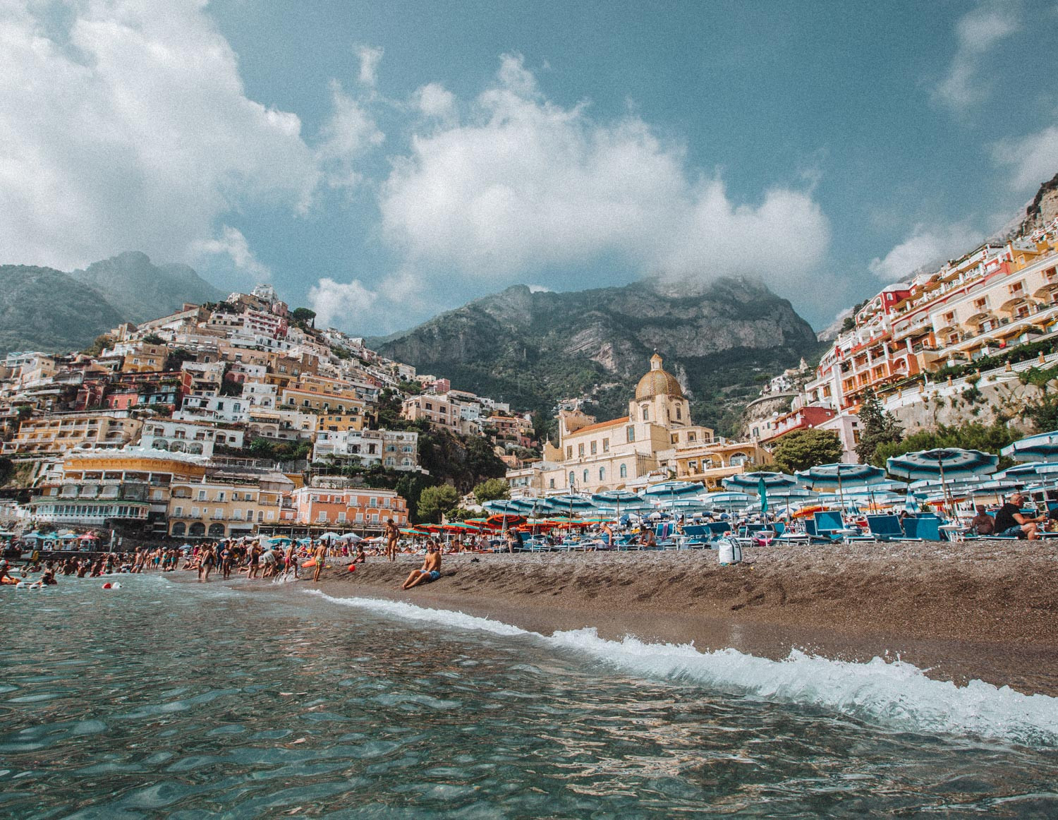 Fornillo Beach, Positano: A tranquil alternative to the bustling Spiaggia Grande, offering a more relaxed beach experience with its clear waters and picturesque setting