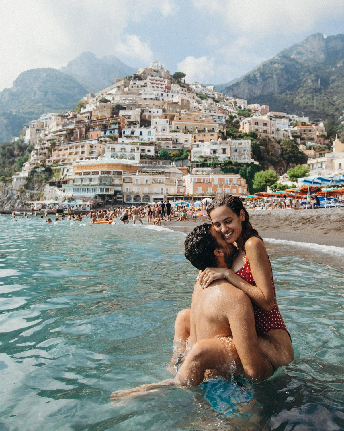 Romantic Positano: A couple enjoying the stunning views of Positano, Italy, showcasing the town's beauty and romantic atmosphere