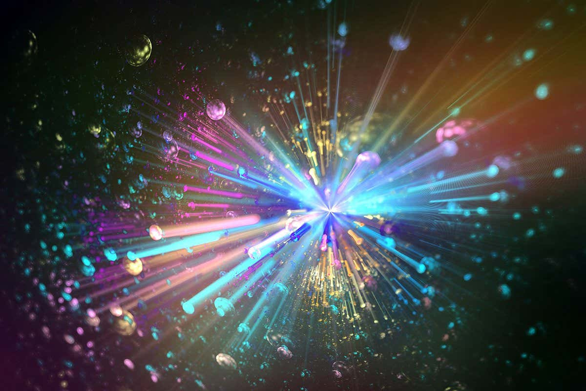 An explosion of colored particles on a dark background, representing the energetic world of particle physics