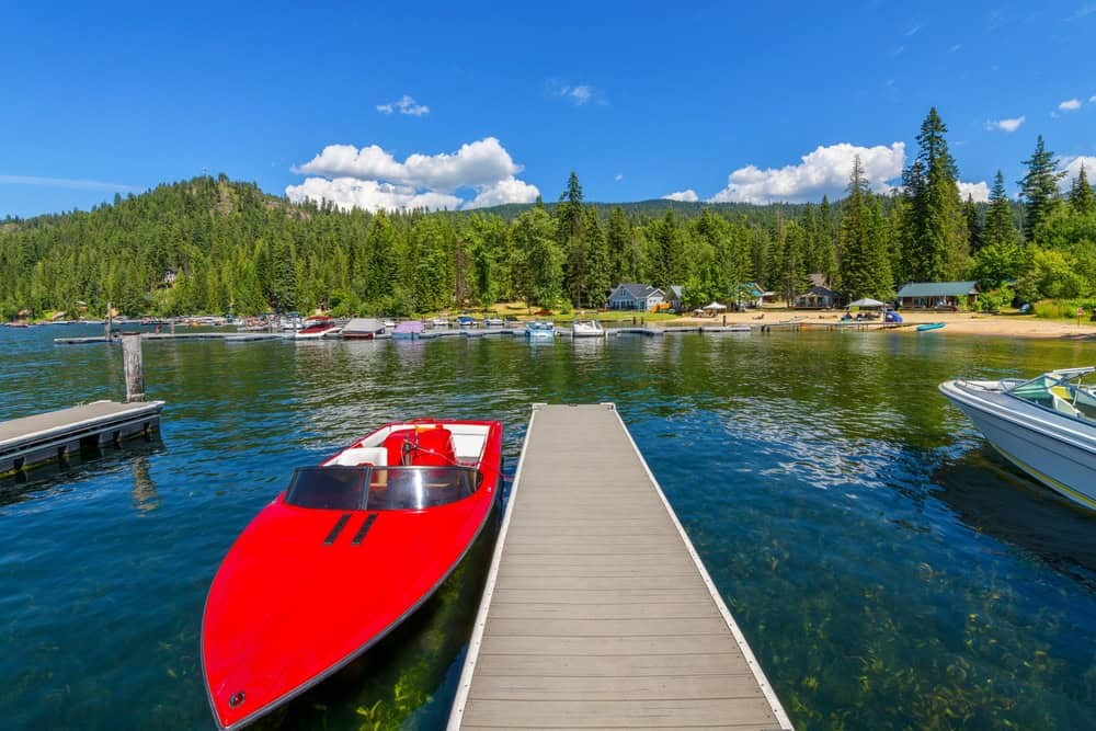 Boating on the serene waters of Priest Lake, Idaho, a perfect summer escape with SIXT.VN's flexible car rental options