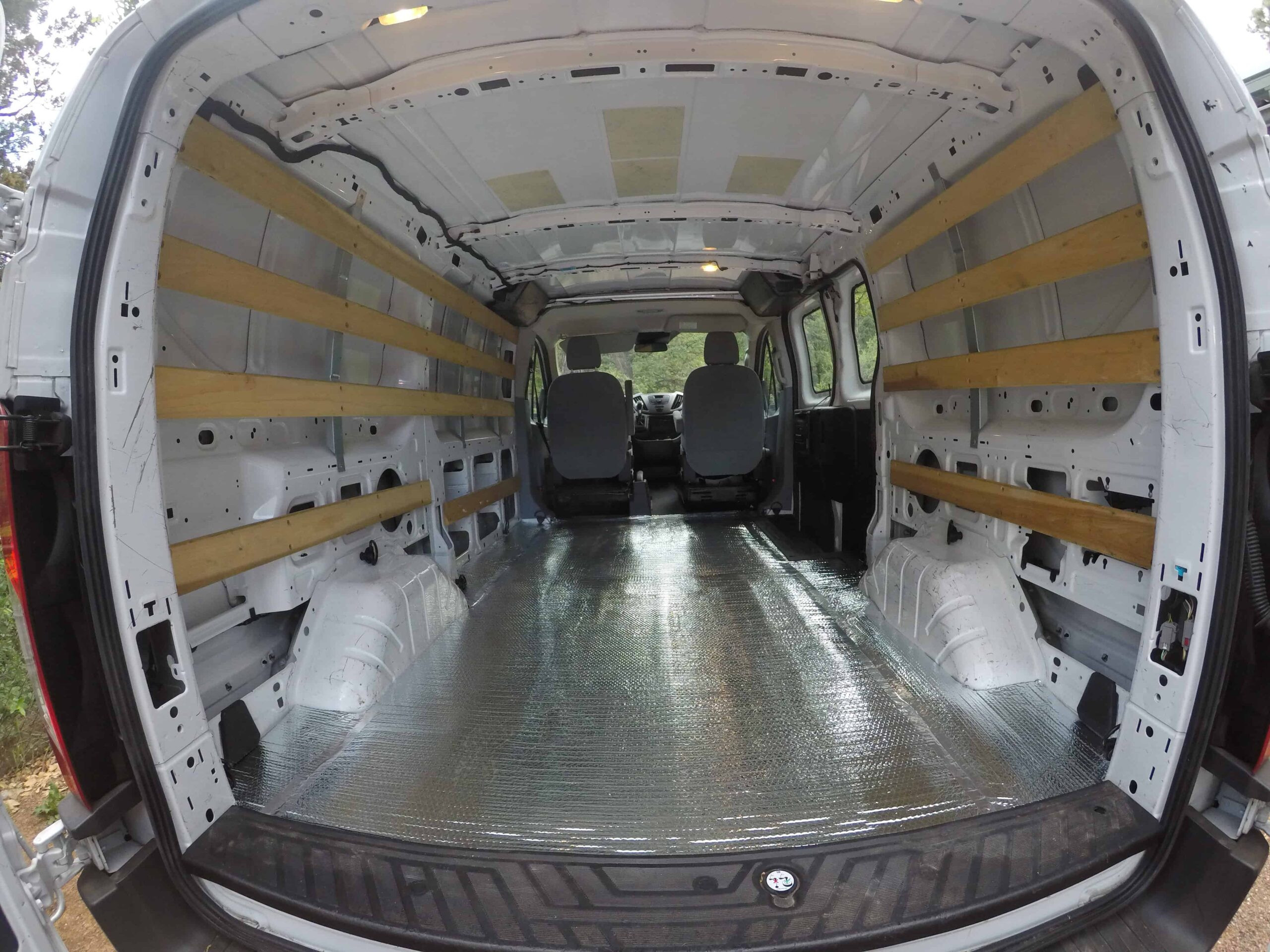 Installing Reflectix insulation in a travel van for temperature control