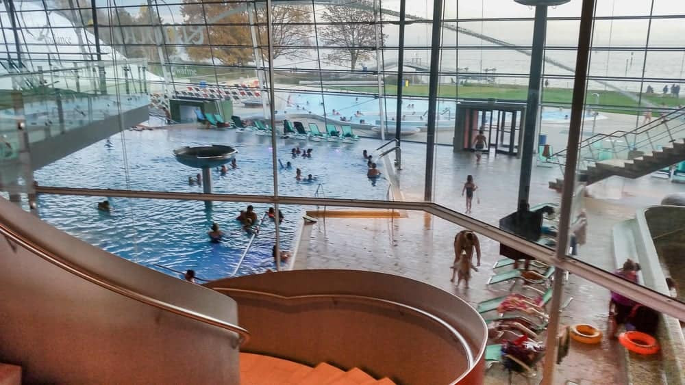 Relax and swim at Bodensee Therme, overlooking Lake Constance and enjoying the spa's warm waters and stunning panoramic views