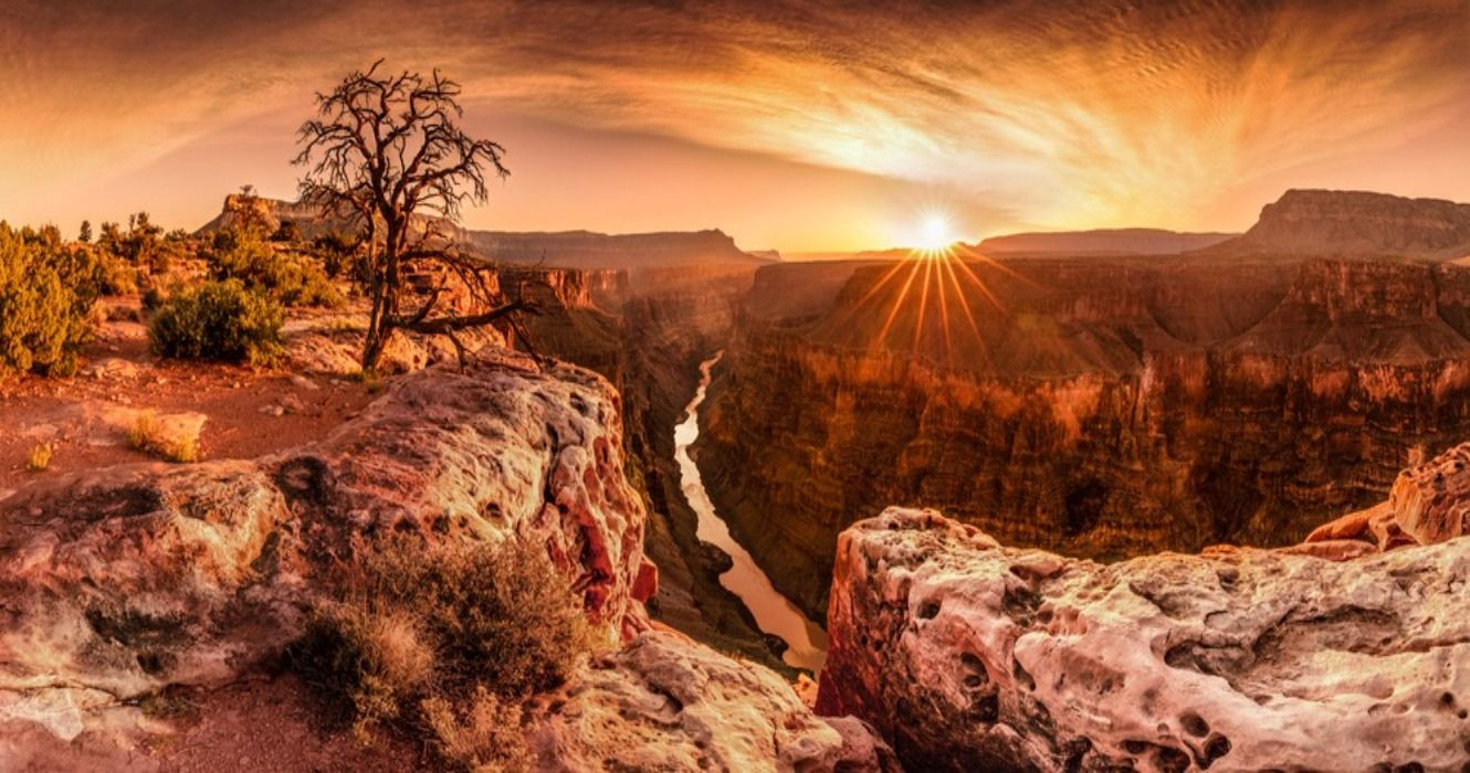 The Grand Canyon at golden hour, showcasing its vastness and depth