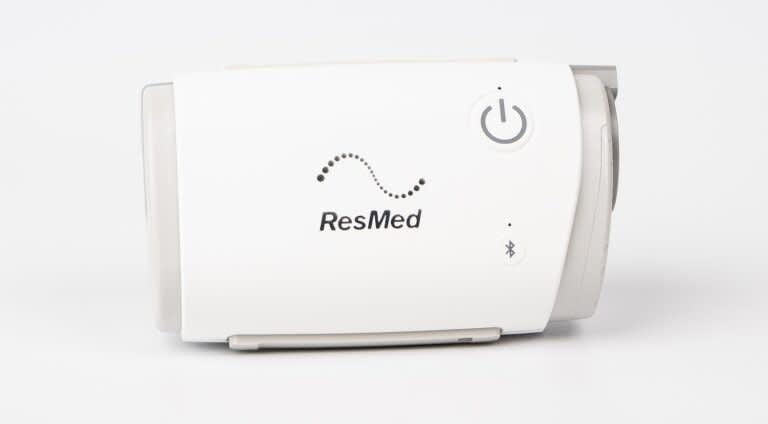 Carrying a CPAP machine on an airplane, ensuring sleep apnea therapy is maintained while flying