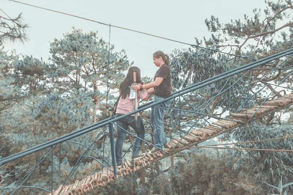 Couple at Maryknoll Ecological Sanctuary, enjoying a serene and romantic moment amidst the lush greenery