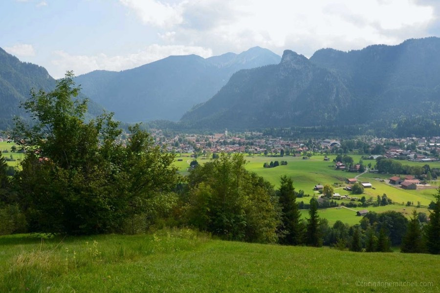 The town of Oberammergau, Germany is visible from a neighboring hill. You can see Oberammergau