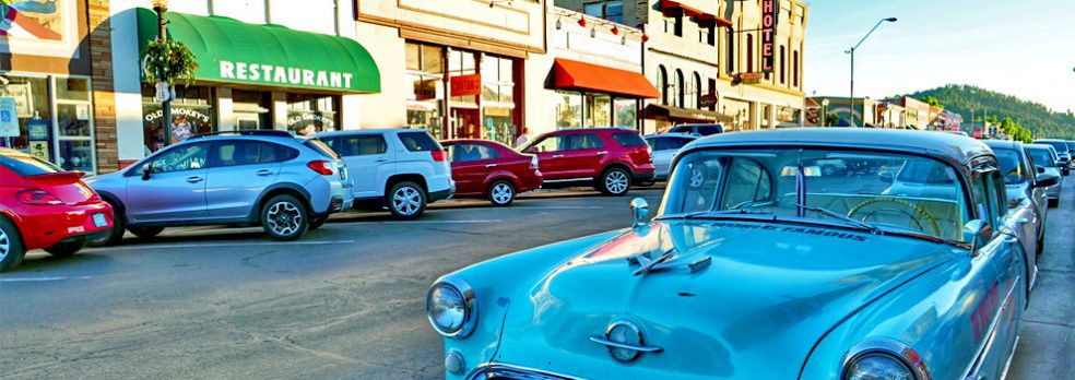 Cars parked along the sidewalk in downtown Williams, Arizona