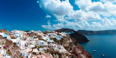 Panoramic view of Santorini's sugar cube houses on volcanic cliffs