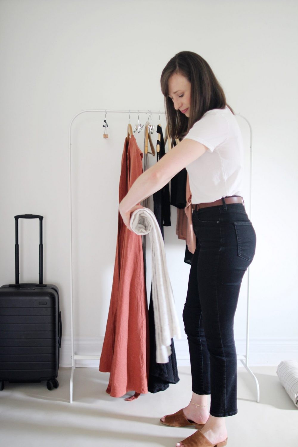 Smoothing out linen while rolling