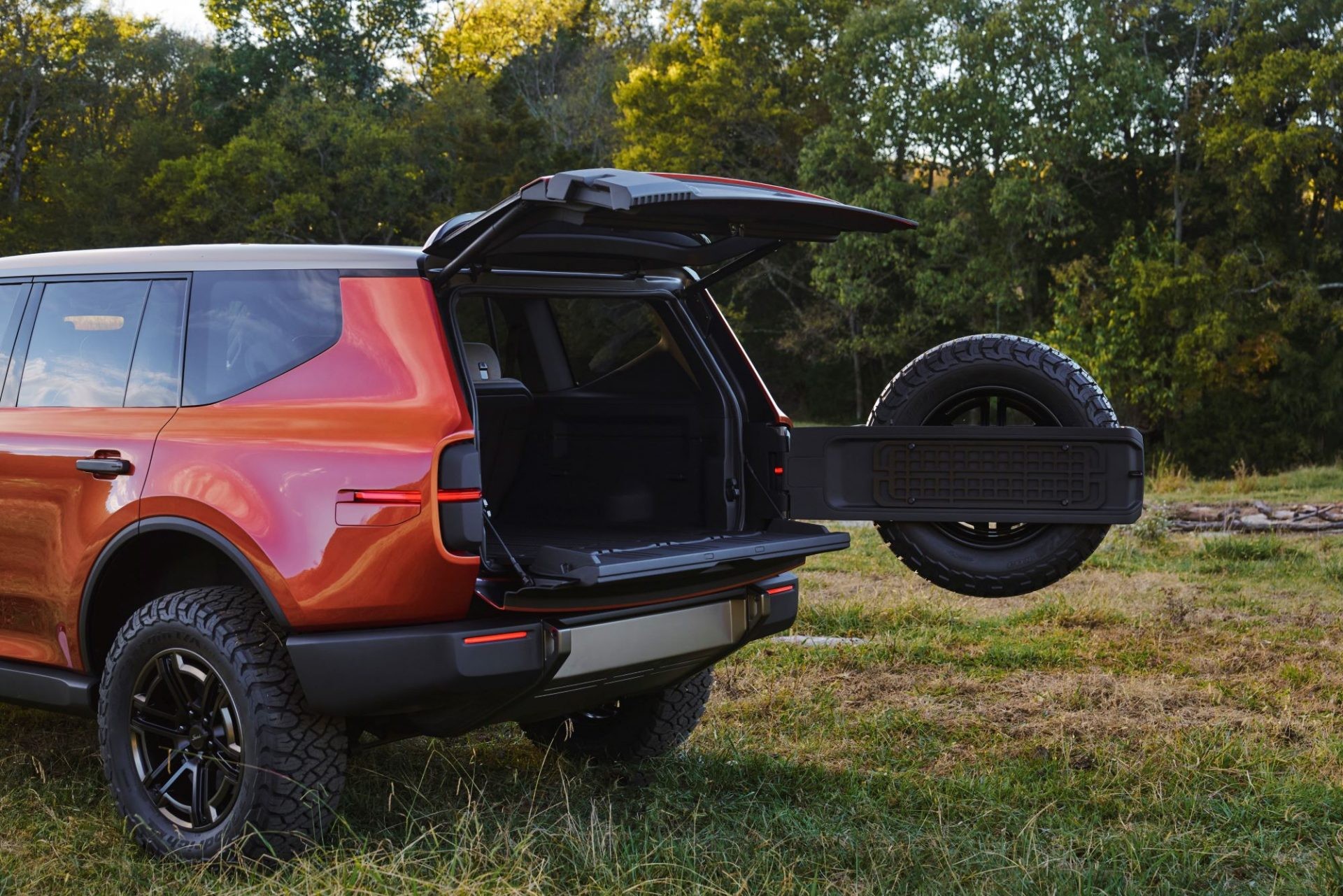 The Scout Traveler SUV parked in front of a scenic Vietnamese landscape