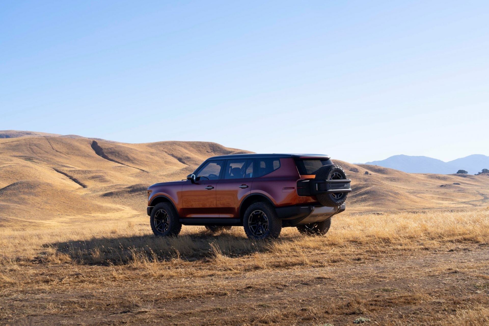 Rear view of the Scout Traveler SUV showcasing its split tailgate and spare tire carrier