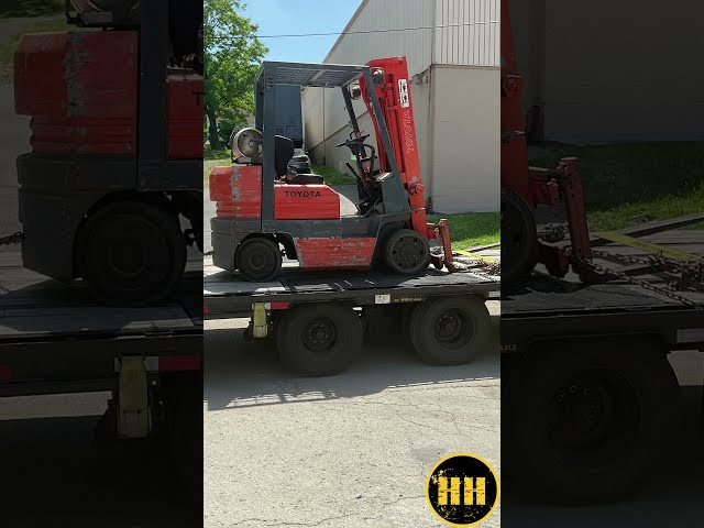 Professional driver inspecting travel trailer hitch