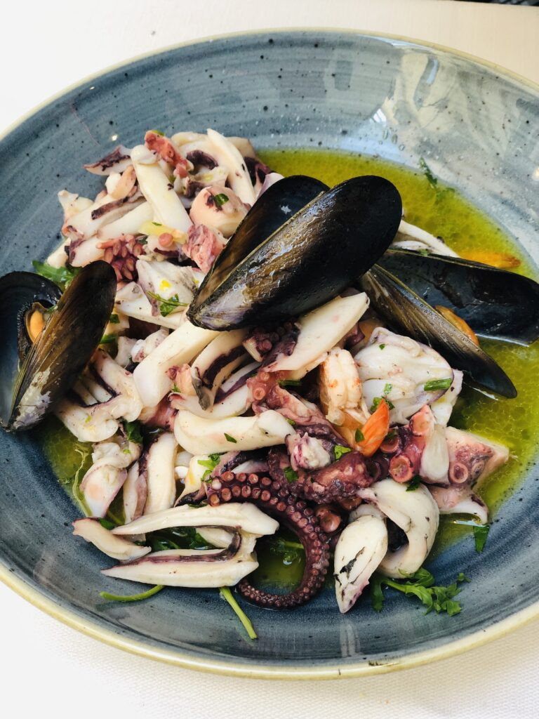 Scenic Tyrrhenian coast of Basilicata with local seafood.