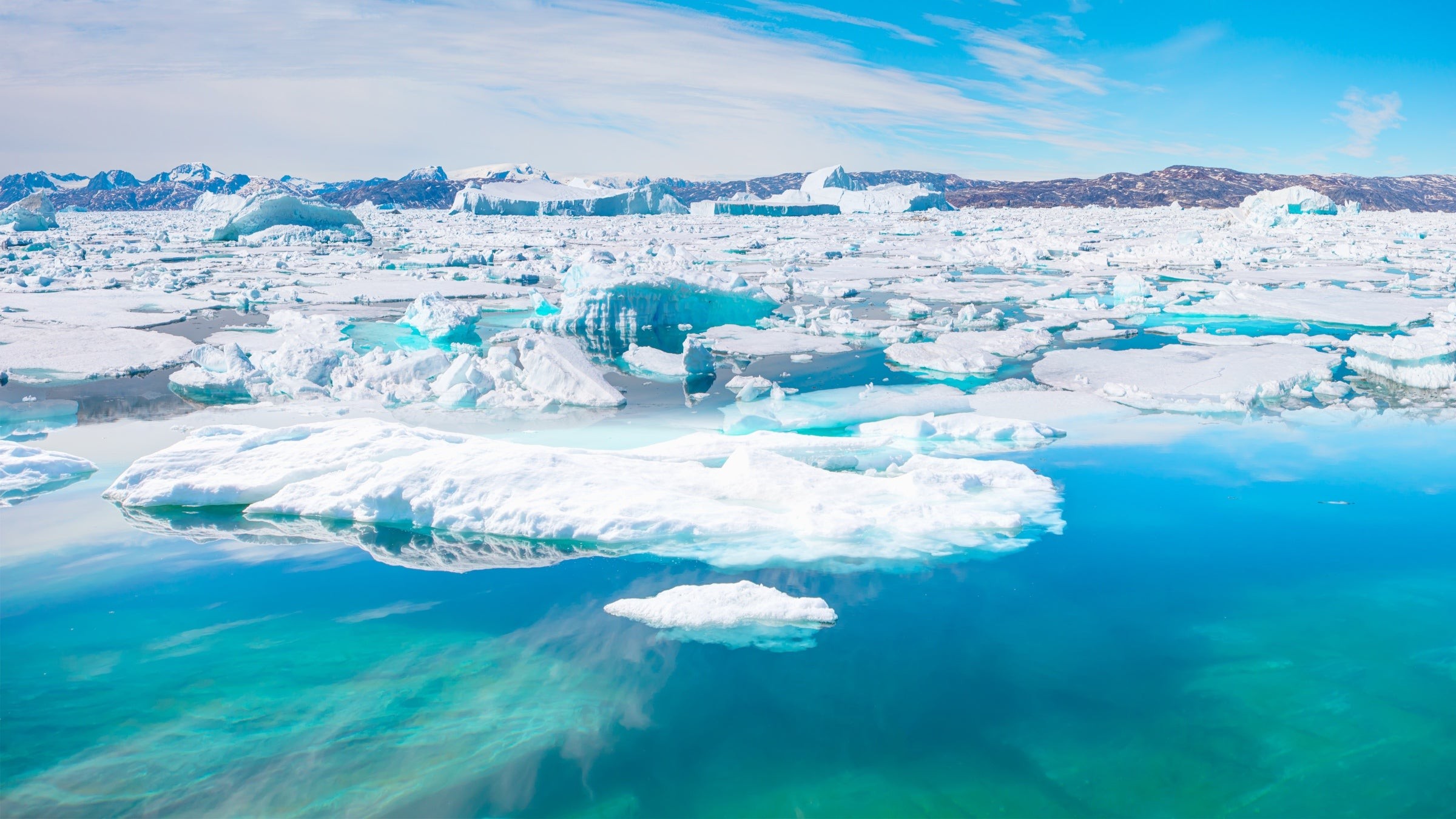 Icebergs dot the waters of Sermilik fjord, in Greenland