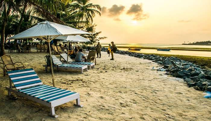 Kalpeni Island's vibrant shoreline is pictured, showcasing its inviting turquoise waters and sandy beaches that offer a serene escape in Lakshadweep.