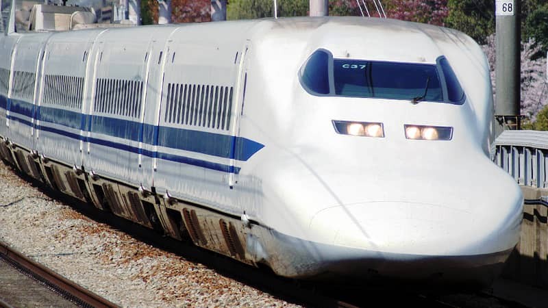 Shinkansen bullet train speeding through the countryside