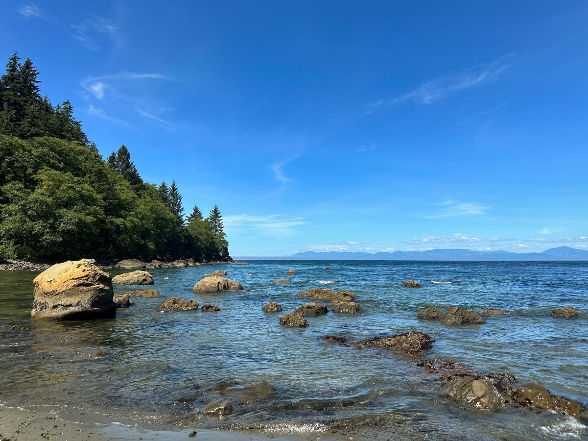 Rocky beach and coastal forest at Shipwreck Point, along the Strait of Juan de Fuca