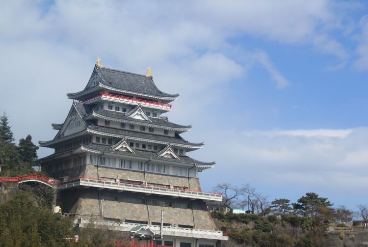 Atami Castle with cherry blossoms during spring