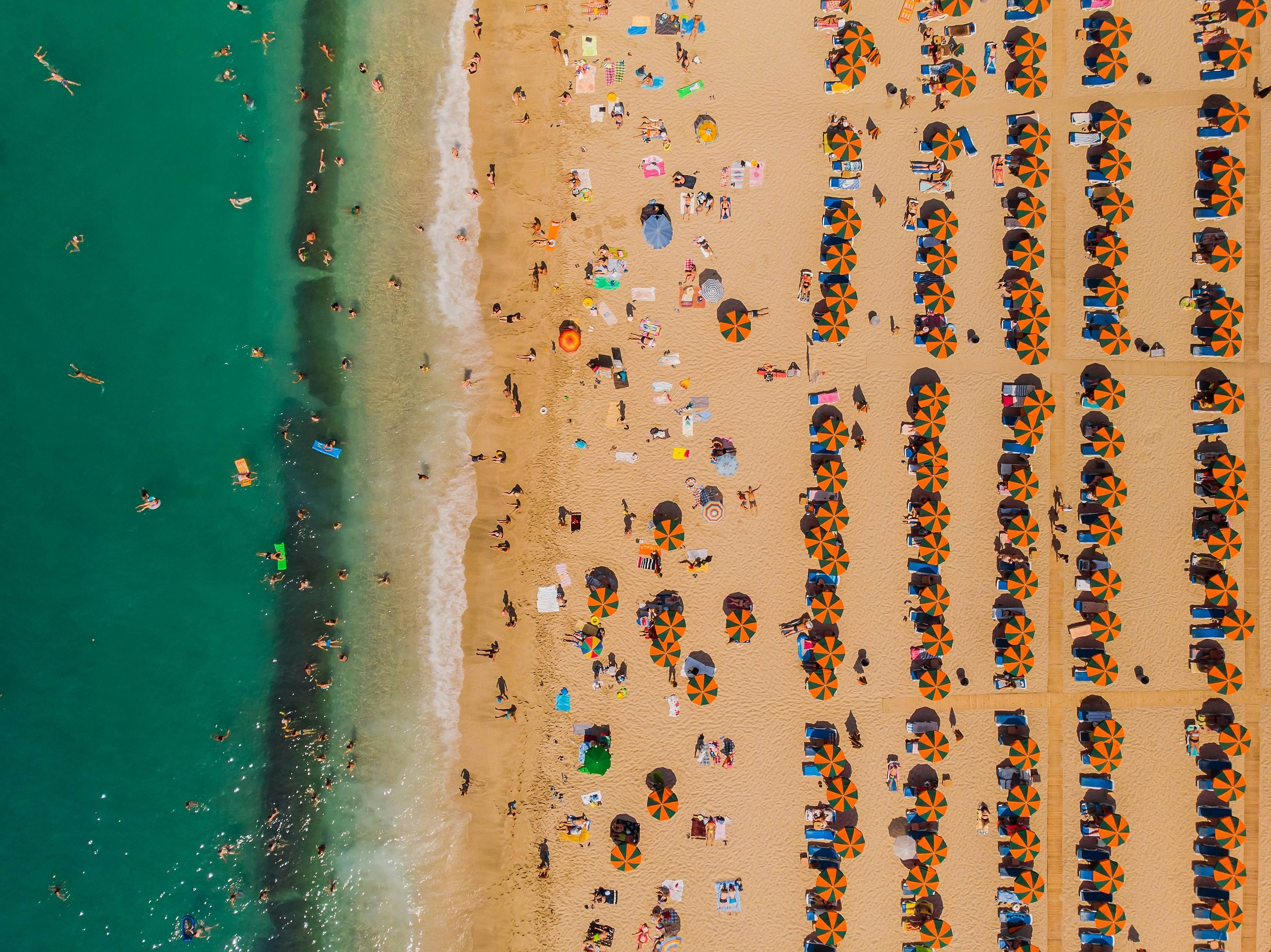 Aerial view of Costa Smeralda in Sardinia, Italy, highlighting the pristine beaches and turquoise waters of the Mediterranean.