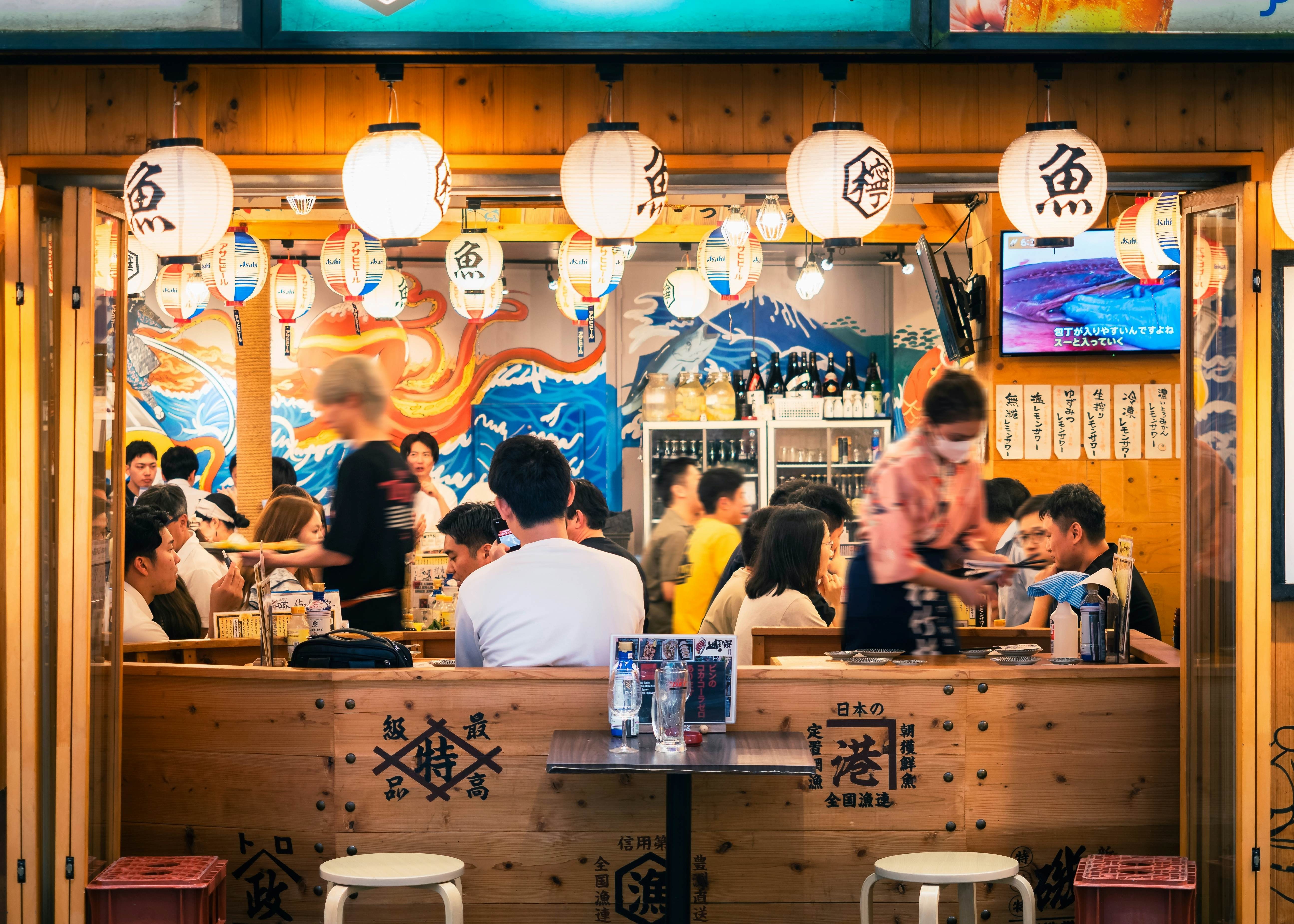 People sit at a small restaurant: Local dining in Yokohama