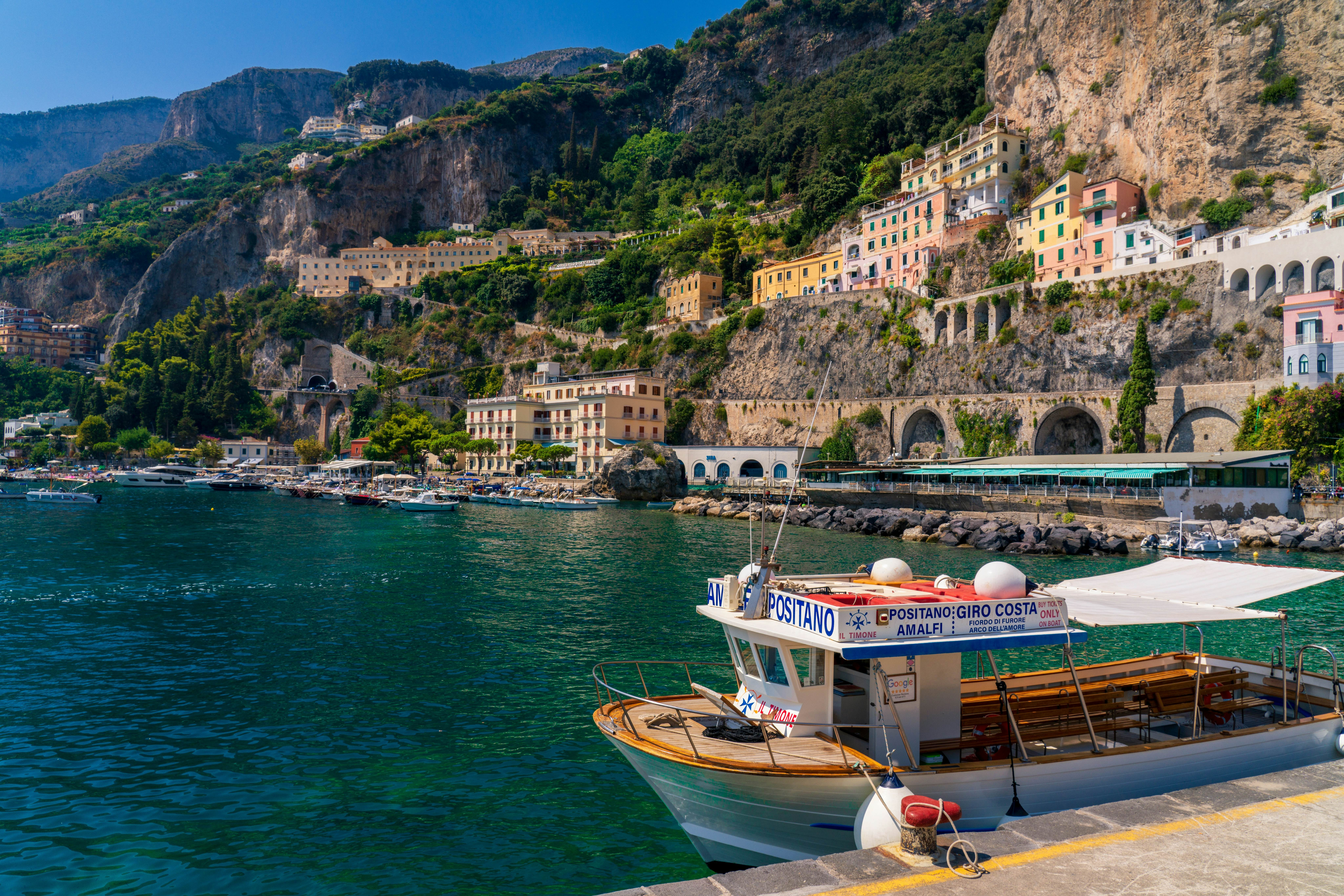 Dockside view of the picturesque Amalfi Coast in Italy, showcasing its stunning coastal scenery and vibrant atmosphere.