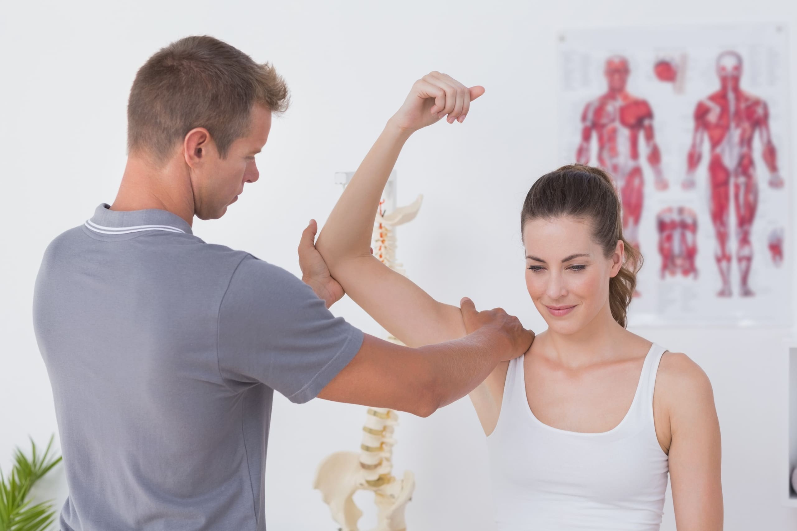 Physical Therapist stretching a patient